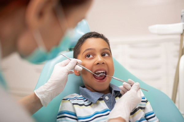 Child receiving gentle dental check-up