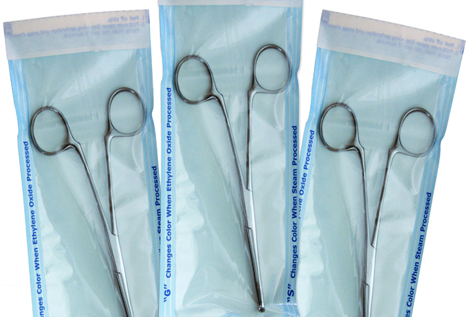 Instruments sealed in sterilization pouches with steam and EO indicators