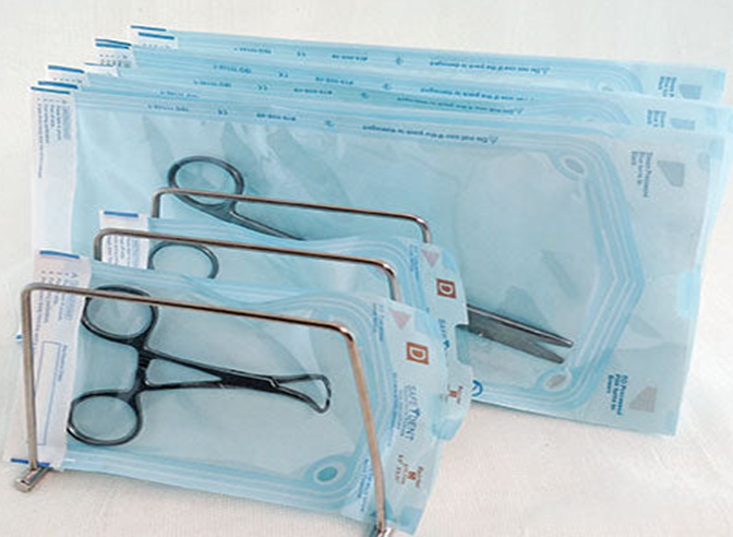 Sealed instruments in autoclave pouches with chemical indicators